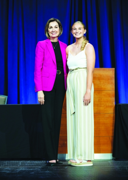 Stanton senior Riley Burke poses with Iowa Gov. Kim Reynolds.