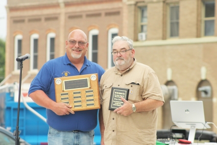 Drue Powers, right, was this year’s recipient of the Red Oak Optimist Club’s Don Maher Memorial Hall of Fame award. Powers was presented the award by Optimist’s Club President Dan Crouse on Aug. 1.