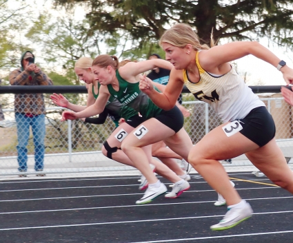 East Mills’ Ellie Hagen, second from left), was a state qualifier in the 100-meters at the state qualifying meet in Tabor. (Joel Stevens/ The Red Oak Express)
