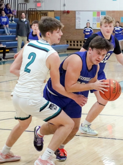 Griswold’s Zane Johnson, shown here driving to the basket earlier this season, scored nine points in the Tigers’ loss to East Mills. (Joel Stevens/The Red Oak Express)