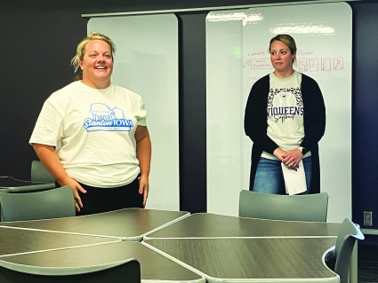 Strategic Planning committee members Jenna Ramsey, left, and Kassie Houdek outline the items prioritized for improvement by Stanton citizens.