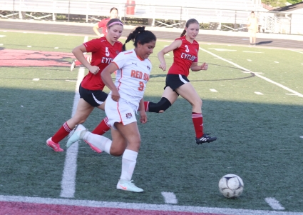 Keidy Camillo Perez attempts to get behind the Harlan defense in last week’s regional match. (Blake West/ Harlan Newspapers)