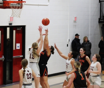 Sophomore Mariel Ramirez (#2) fights for a rebound against Shenandoah. (Photo by Julie Fouts)
