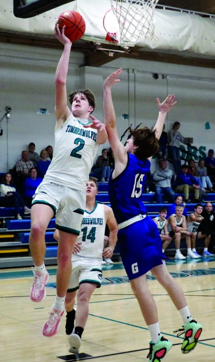 Southwest Valley’s Alex Morgan lays in two of his game-high 27 points in the win over Griswold.