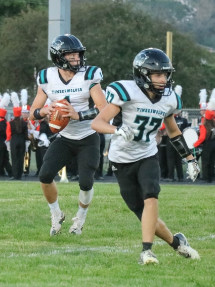 Southwest Valley’s Wyatt Shires drops back for a pass in a game earlier this season. Shires threw for 62 yards and rushed for 75 yards in the Timberwolves’ 20-7 loss to ACGC. (Joel Stevens/ The Red Oak Express)